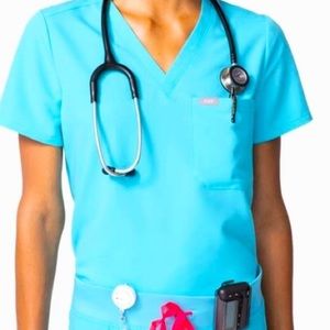 Figs Neon Blue. With hot pink drawstring.